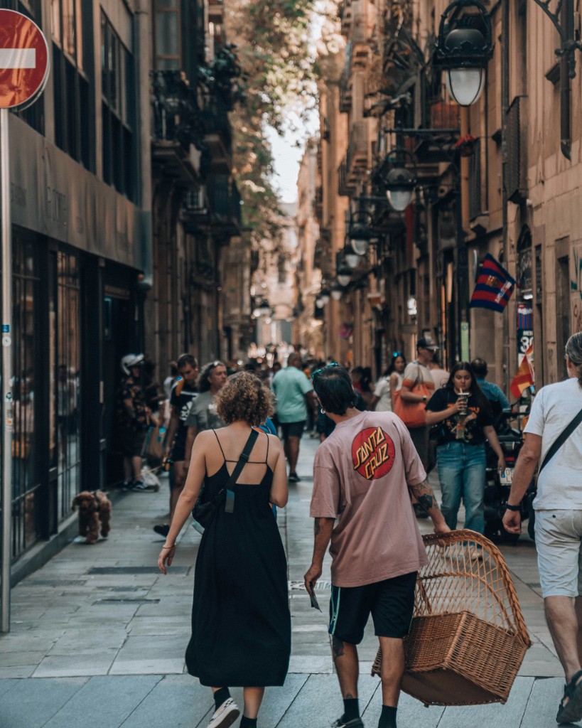 Couple walking down a sunlit city street