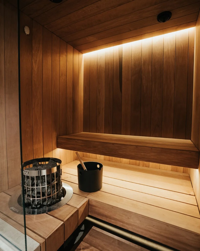 Outdoor thermal soak overlooking wooded grounds